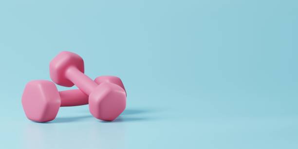 istock Minimal pink dumbbell on blue background. Weight training activity, bodybuilding exercise, daily gym and fitness, dieting for health, sport heavy for muscular building equipment concept. 3d rendering 1422659436