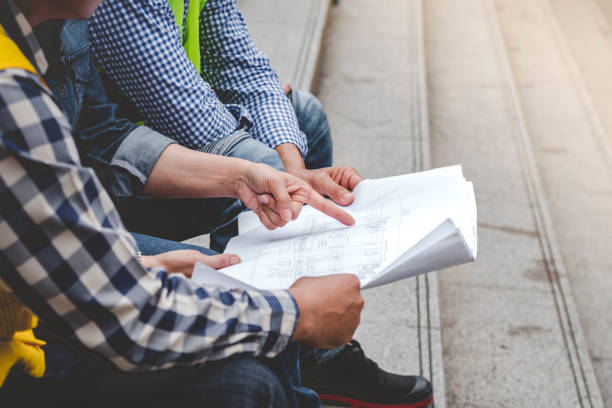 istock Civil Construction engineer teams shaking hands together wear work helmets worker on construction site. Foreman industry project working engineer teamwork. Two asian engineer team shake hands together 1422666119