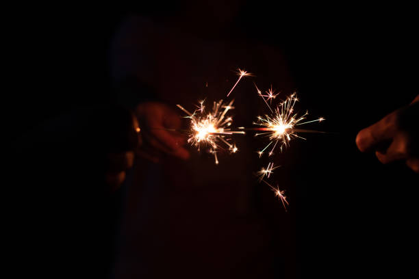 istock closeup sparkler light with dark background 1422666129