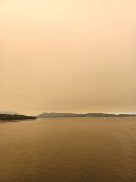 BC Wildfire Smoke Thick as BC Ferries Passengers Arrive in Victoria BC 1 stock photo