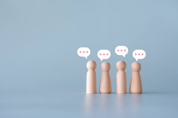 istock Group of wooden human figures communication connecting concept 1422668999