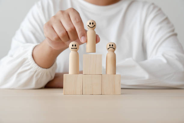 istock Leadership concept using wooden figures faceless human and blocks 1422669196
