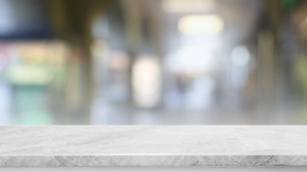 istock Empty white marble stone table top and blur glass window interior restaurant banner mock up abstract background - can used for display or montage your products. 1422669556