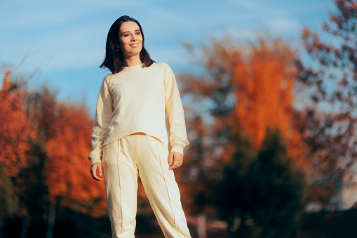 Fashionable autumn girl wearing an athleisure tracksuit