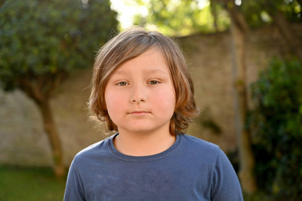Children looking at camera in spring
