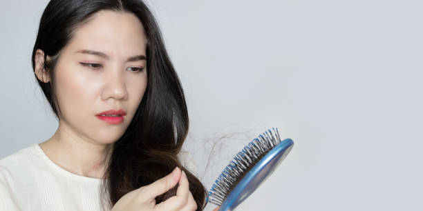 istock Asian beautiful woman is looking 1422695654