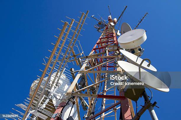 Red And White Communication Tower With Satellites Stock Photo - Download Image Now - Biological Cell, Blue, Communication