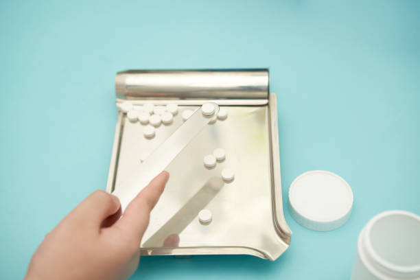 istock pharmacy count pill on tray for prescription 1422697102