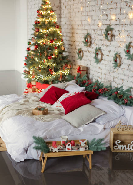 istock Light Christmas bedroom with red decorations 1422701776