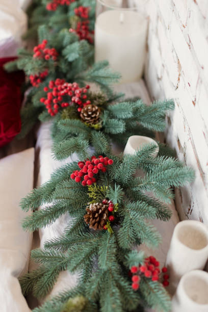 istock Christmas garland with red berries decoration 1422702085