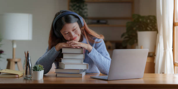istock Young college student have question and answer to teacher by video call E-learning ,online ,education concept 1422705321