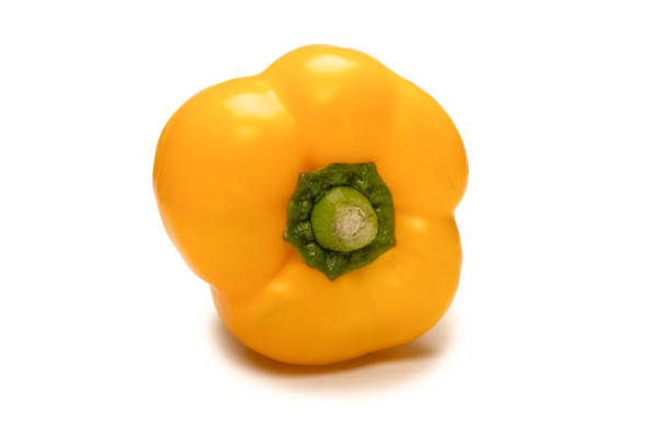 Yellow bell pepper isolated on a white background.