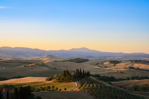 View from above, stunning aerial view of the Val D'Orcia during a beautiful sunrise. Val D'Orcia is  a wide and beautiful countryside in southern Tuscany.