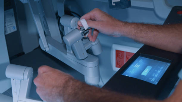 istock Surgeon operating a medical robot during an operation. Close-up 1422720109