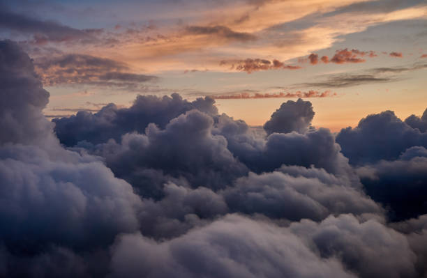 istock Flying above the clouds during sunset, Norway. 1422725240