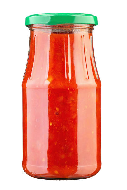 istock Canned hot tomato sauce in a jar isolated on a white background. 1422729786