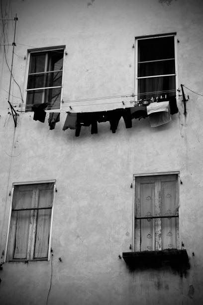istock Tuscan house with a cloth line hanging between windows 1422731454
