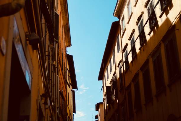 istock Colourful Tuscan houses bathing in sunlight with focus on shadows 1422731530