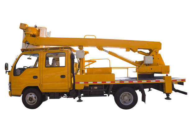 Side view of a mobile construction crane on a construction site.