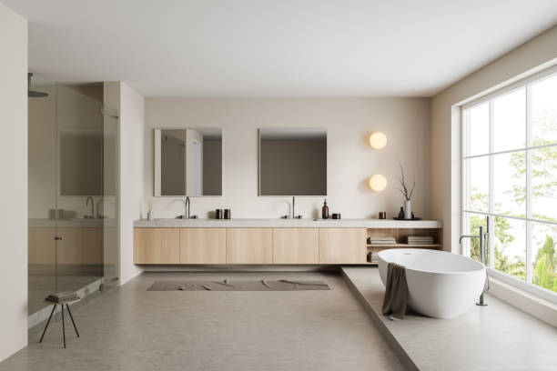 istock Light bathroom interior with bathtub, shower, sink and panoramic window 1422735112