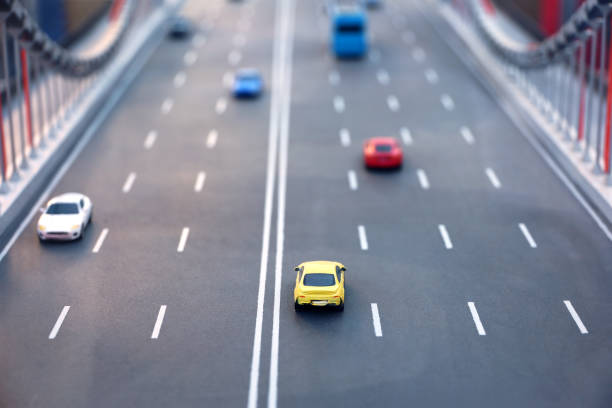 istock Toy cars and buses on multi lane highway 1422736114