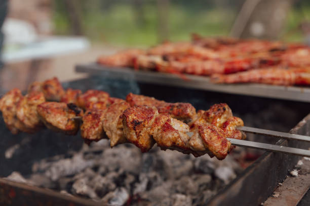 istock Shish kebab made from marinated pork and cooked on barbecue grill over charcoal. Traditional barbecue picnic food. Outdoor food concept. Lifestyles. 1422736726