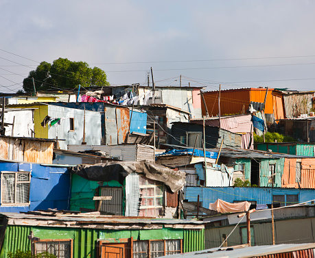 View of a poor informal area near Cape Town, with houses made of wood and corrugated iron.