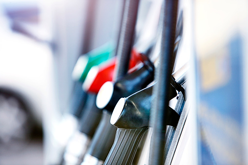 View of the handles of gas pumps with atmospheric shallow depth of field.