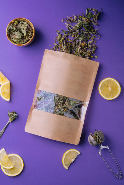 istock Dried and fresh tea leaves with lemon slices 1422746409