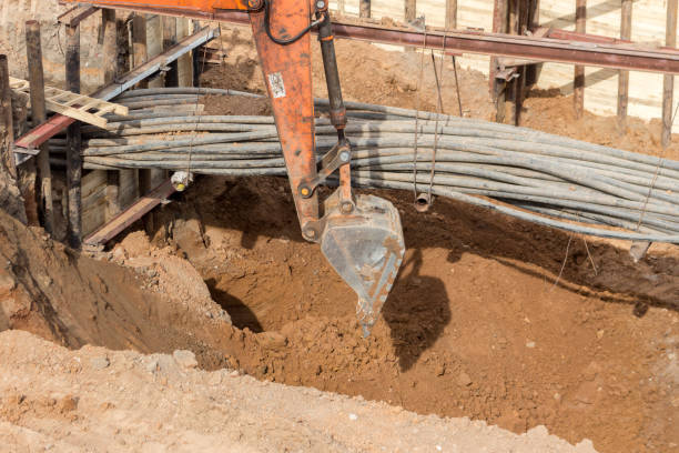 istock The excavator is working on a city construction site. Repair and construction concept. 1422750073