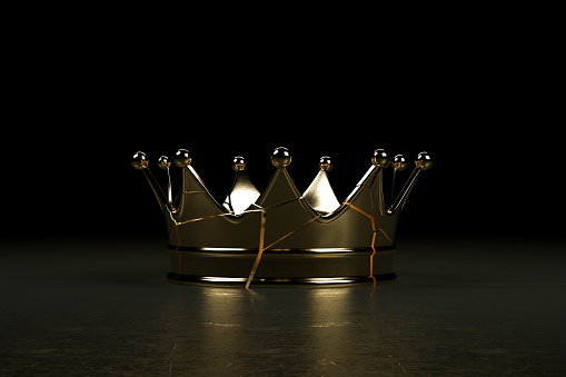 3d rendering of cracked queen's crown, black background.