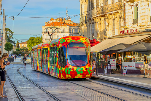 Montpellier, France- August 23, 2022: Colourful modern tram on the street in the central part of the city.