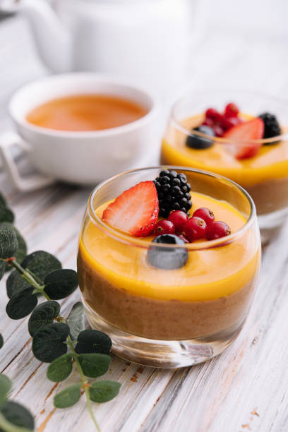 istock Delicious panna cotta with mango with berries 1422755075
