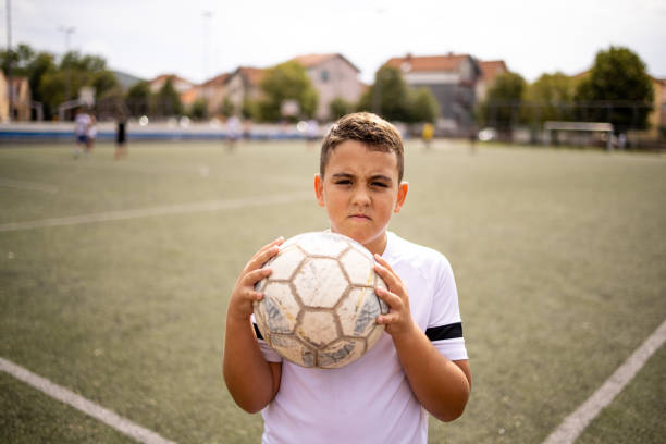 istock Boy soccer player portrait looking at camera 1422755712