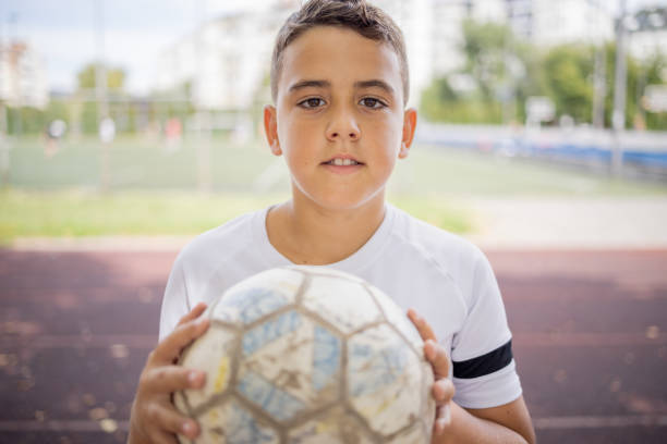 istock Boy soccer player portrait looking at camera 1422755777