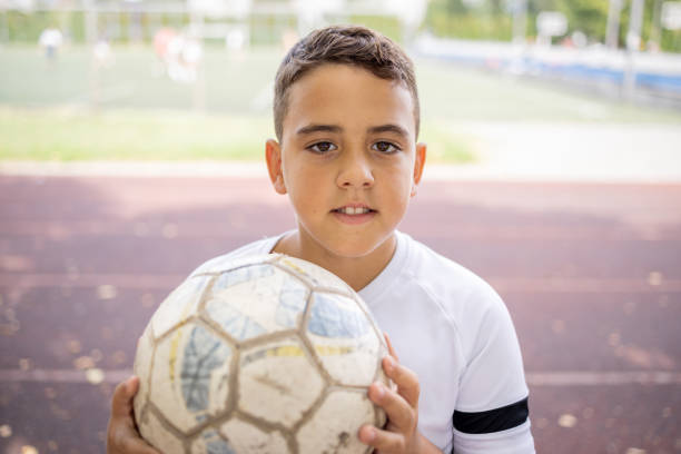 istock Boy soccer player portrait looking at camera 1422755944