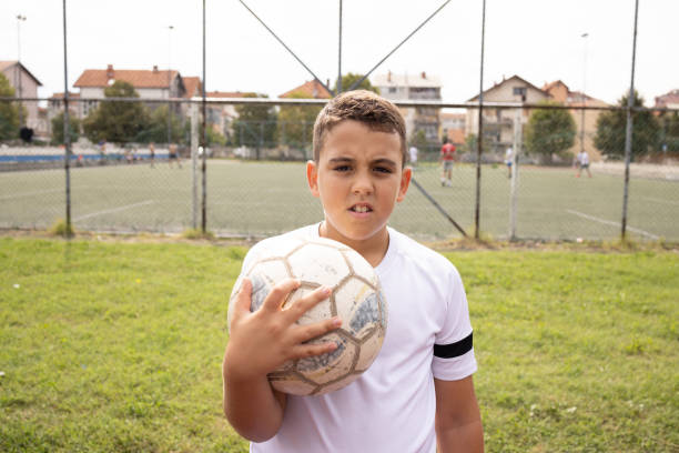 istock Boy soccer player portrait looking at camera 1422755974