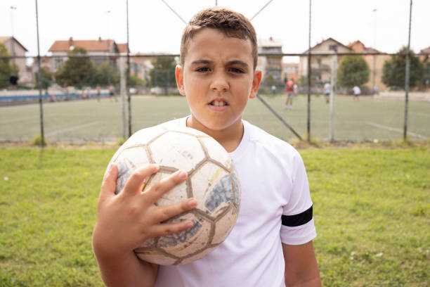 istock Boy soccer player portrait looking at camera 1422756066