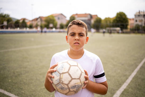 istock Boy soccer player portrait looking at camera 1422756744