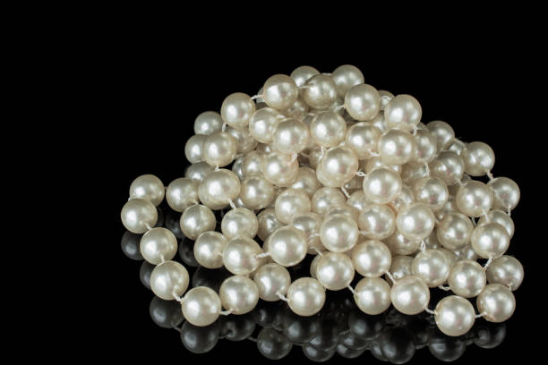 istock Pearl necklace black white elegant image on black 1422757545