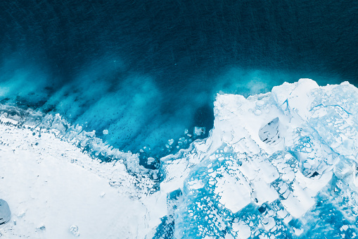 Iceland. An aerial view of an iceberg. Winter landscape from a drone. Jokulsarlon Iceberg Lagoon. Vatnajokull National Park, Iceland. Traveling along the Golden Ring in Iceland.