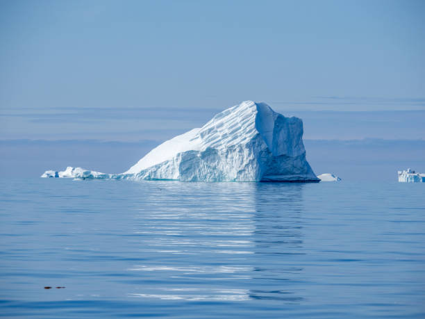 Giant icebergs just off the coast of Disko Island,  near Qeqertarsuaq, Disko Bay, Western Greenland stock photo