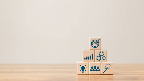 istock hand woods block cube with icon company strategy development, Concept success and business goals. 1422765863