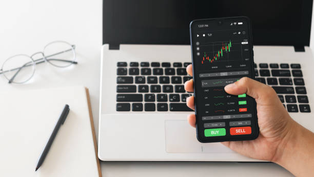 istock Businessmen work with stock market investments using smartphone to analyze trading data. smartphone with stock exchange graph on screen. Financial stock market. 1422767762