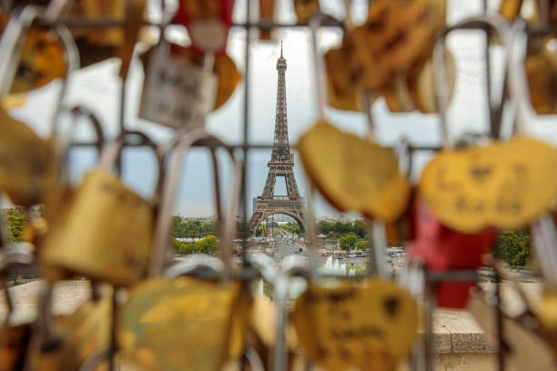 eiffel tower seen through the fence with love padlocks on the Tocadero, Paris stock photo