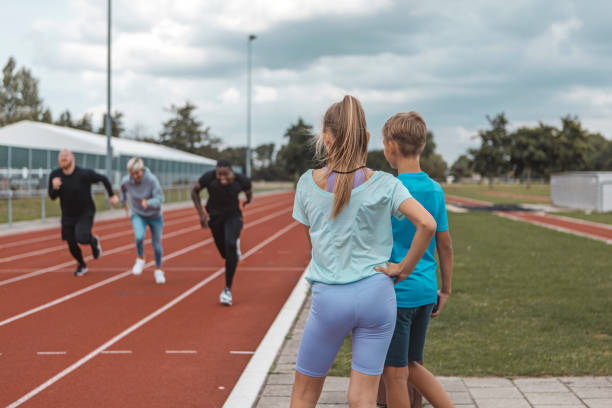istock Two athletic children working hard on the running track 1422770775