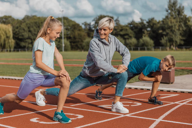 istock Athletics mother running coach working with her children during a training session 1422770896