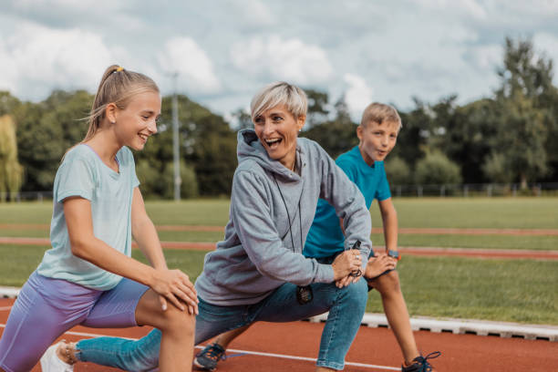 istock Athletics mother running coach working with her children during a training session 1422770901