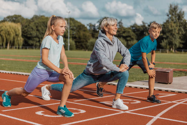 istock Athletics mother running coach working with her children during a training session 1422770903