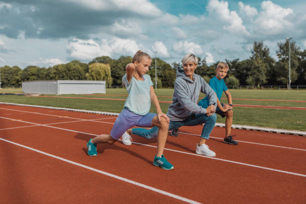 istock Athletics mother running coach working with her children during a training session 1422770910